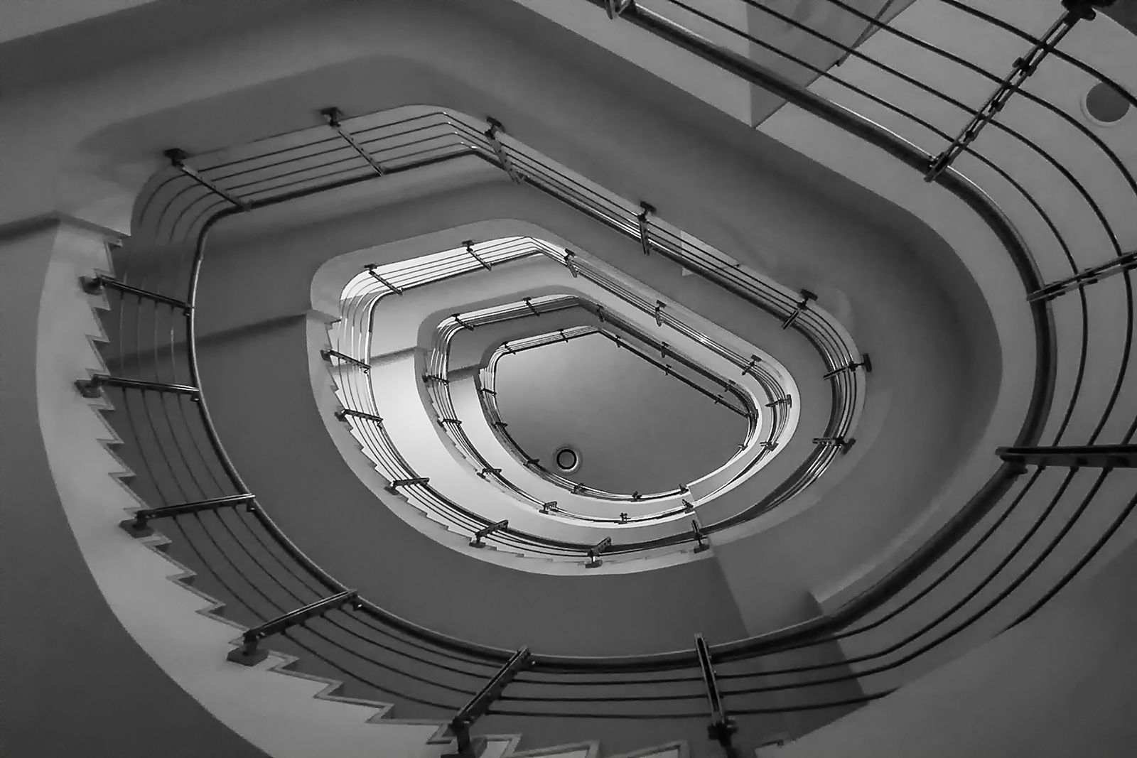 Contemporary spiral staircase with metal railings