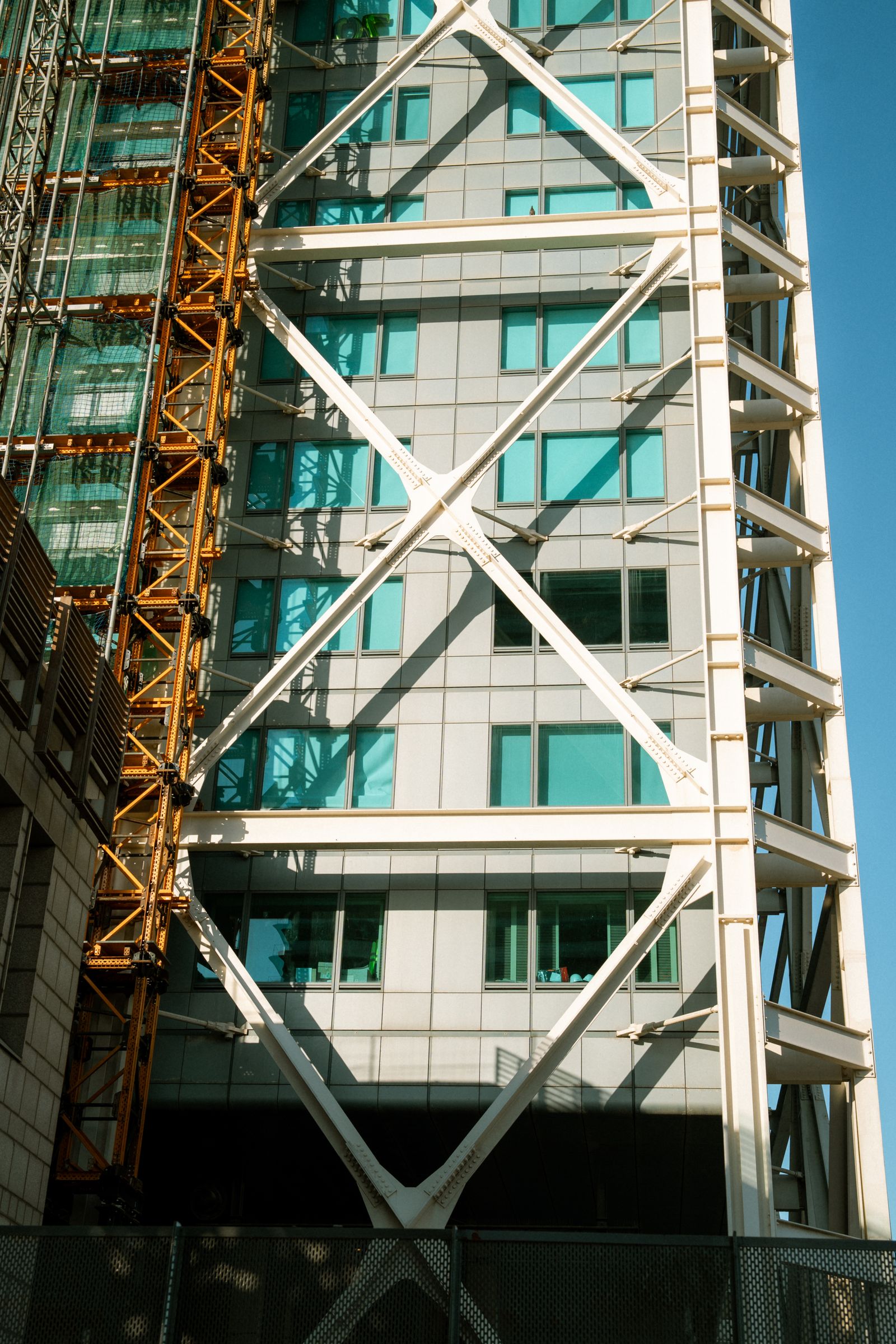 Structural steel beams and cross-bracing on a building frame